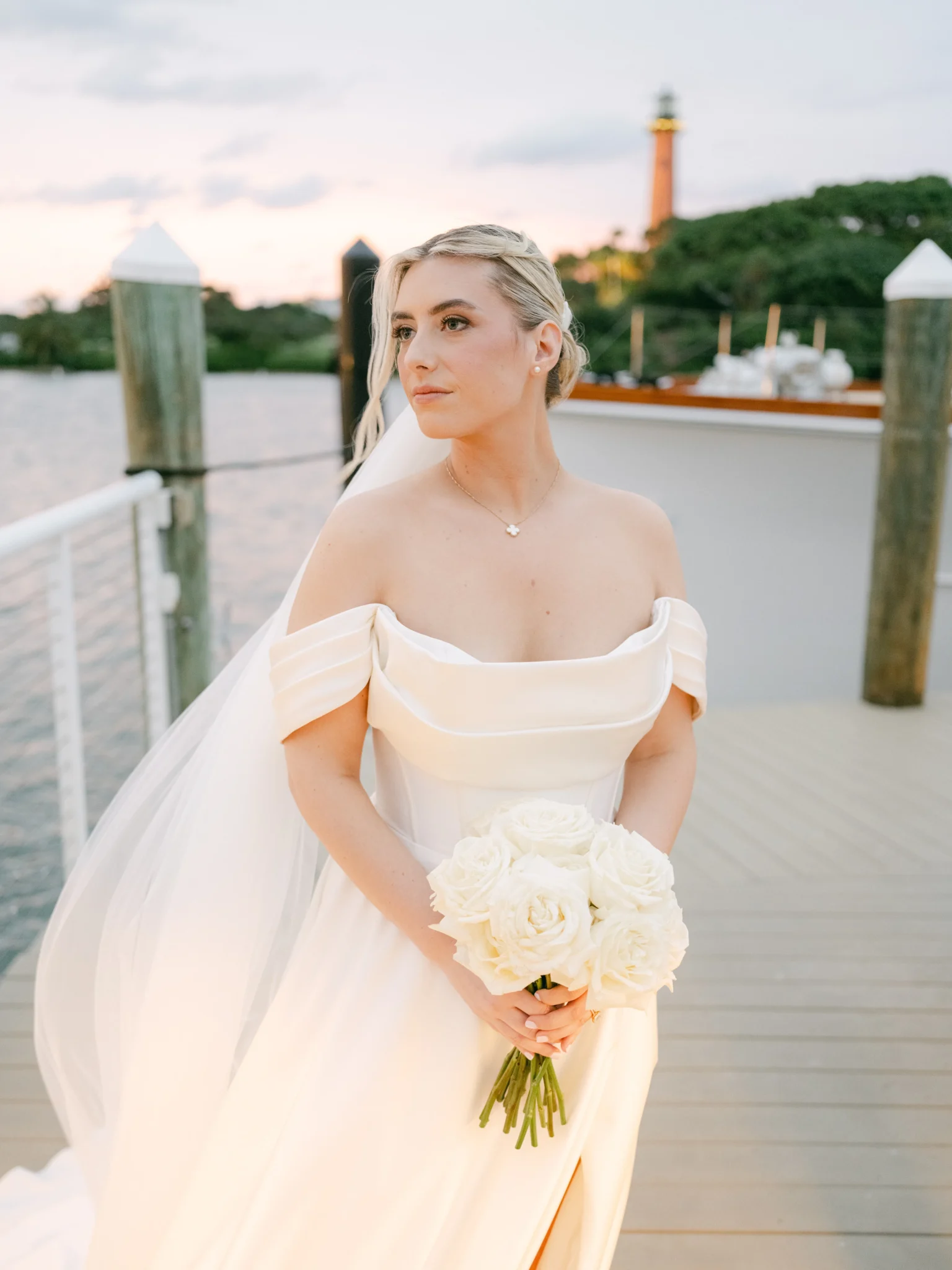 bride wearing natural makeup for weddings on her wedding day at the beach
