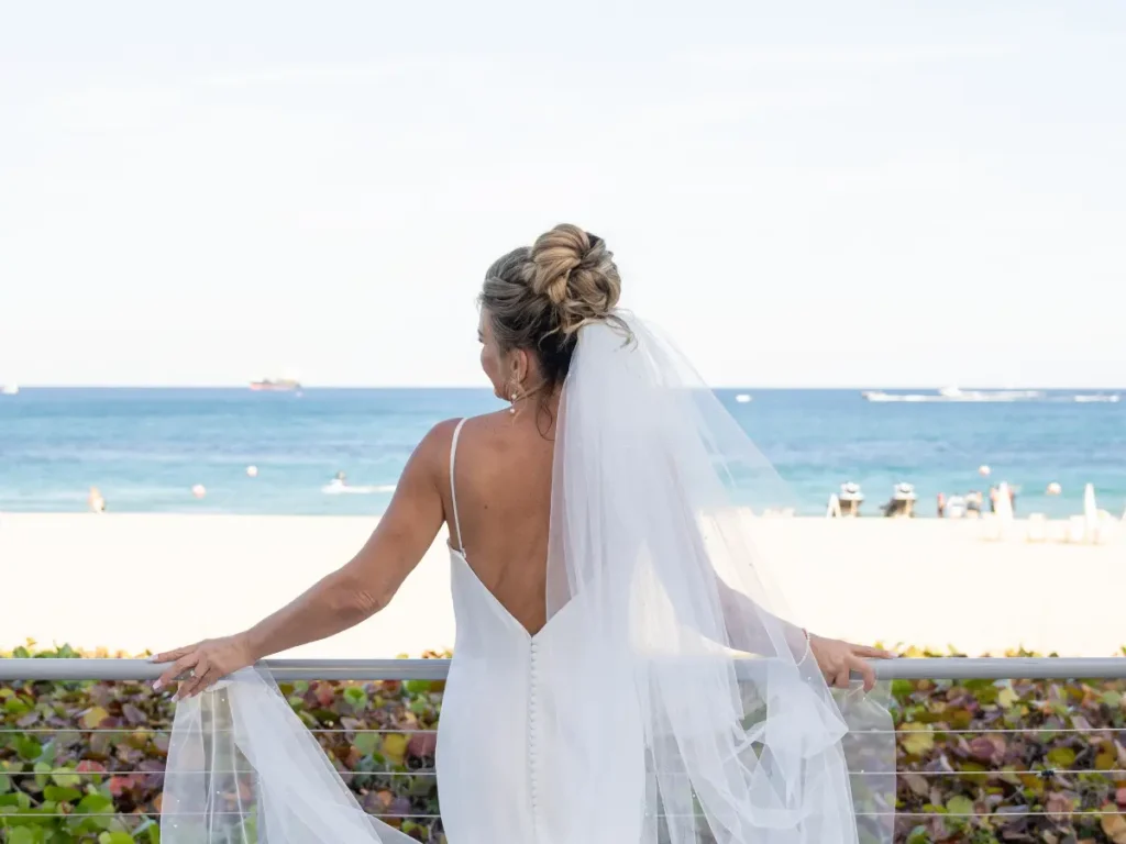 Structured low bridal updo that holds in South Florida humidity for a bride at Marriot Harbor Beach inFort Lauderdale